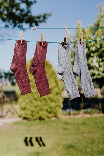 Photo by Karolina Grabowska: https://www.pexels.com/photo/multicolored-socks-drying-on-rope-with-clothespins-in-garden-4495753/