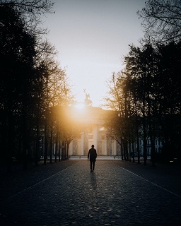 Photo by Naro K: https://www.pexels.com/photo/silhouette-of-a-man-walking-in-the-alley-toward-the-brandenburg-gate-in-berlin-germany-18900657/