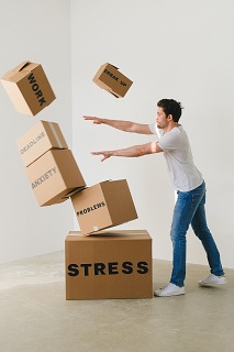 Photo by SHVETS production: https://www.pexels.com/photo/man-falling-carton-boxes-with-negative-words-7203956/